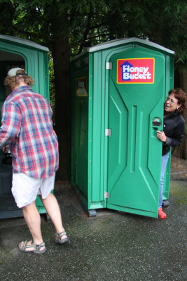 AS BIG FOOT ENTERS THE PORTA-POTTY, TERRI SCREAMS, OH NO!!  NOT ANOTHER BIG FOOT.....DON'T STINK IT UP THIS TIME, OKAY?