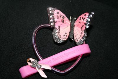 Things I arranged to promote finding a cure for breast cancer.  The bracelet symbolizes sisterhood, the heart symbolizes love for those who have gone through it, those who are now battling and those that have died from it. The butterfly represents the freedom of being a SURVIVOR.