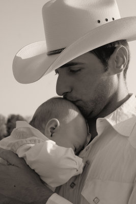KISSING HIS SON