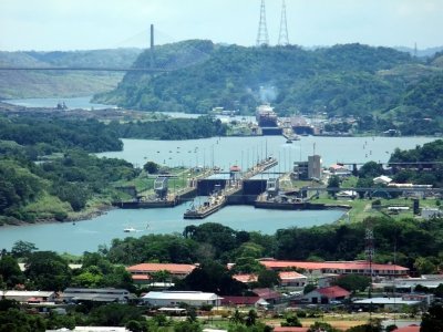 The Centennial Bridge in the Background, a Large Ship in the Pedro Miguel Locks, and the Miraflores Locks in the Foreground.