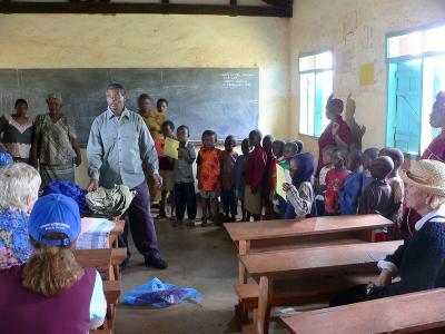 The head teacher, and the handing out of the donated uniforms.