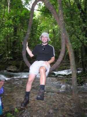 Simon on a tree limb/root made into a swing