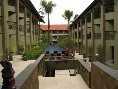 standing in the lobby looking out at the hotel area with pool