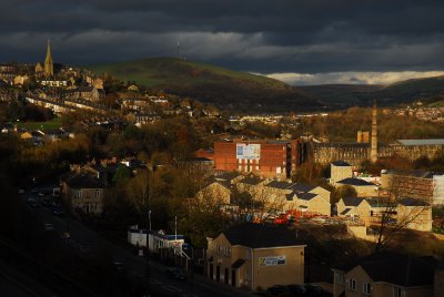 Mossley with St Johns The Baptist and Woodend Mills Chimney.