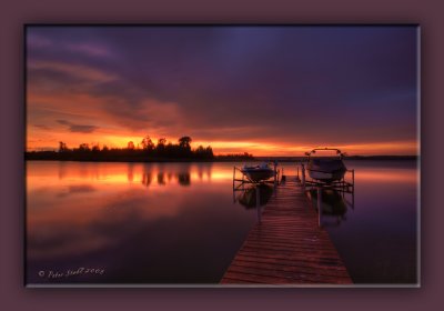 lake pier at sunset after the rain.jpg