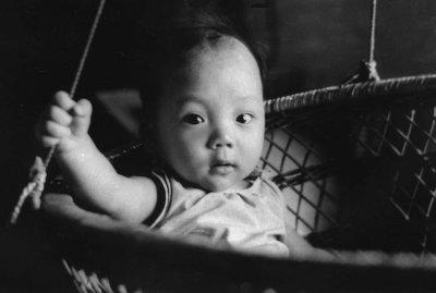 8-month-old boy in his cradle
