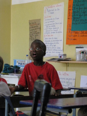 248 Child singing at bilingual school.jpg
