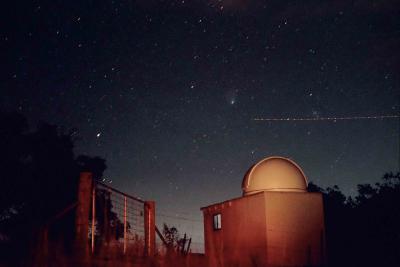 Comet, plane and Beehive cluster over Mt Campbell Observatory