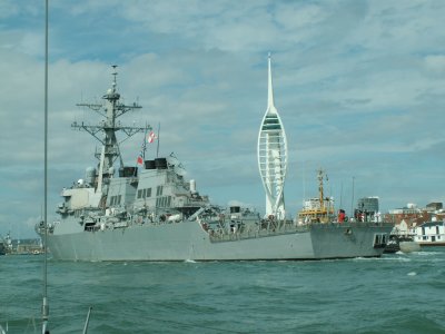US Navy Ship entering Portsmouth alongside us, with spinaker tower in background