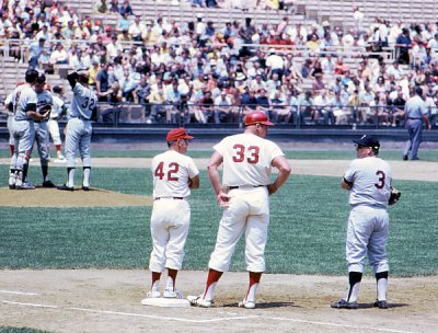 Coach Nellie Fox (42), Frank Howard (33), and Harmon Killebrew (3) in foreground.