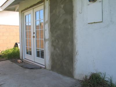 Stucco over old door area
