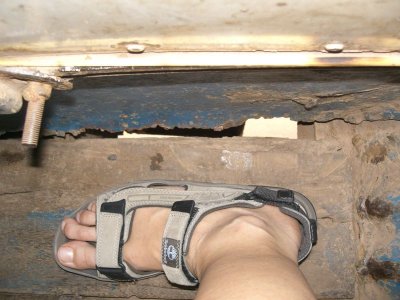 Hole in floorboard, bus Vientiane - Vang Vieng