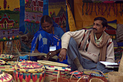 The craftswoman and the salesman, Surajkund Mela, Delhi