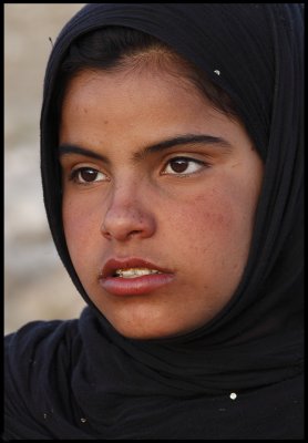 12-year old girl selling postcards at Palmyra