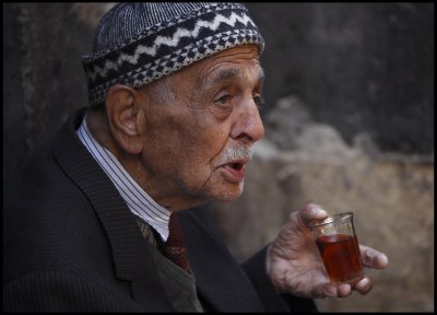 Old man having chai  in Damascus Old city