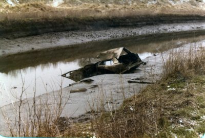 Burnt out car in the River Tees