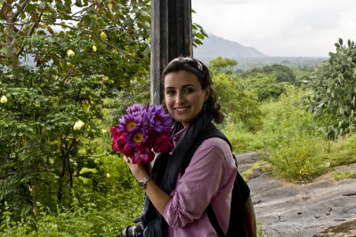 The Beautiful Iranian, with flowers for the Buddha