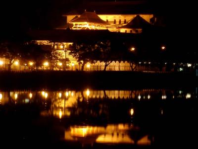 Temple of the Tooth at night reflecting in Kandy lake