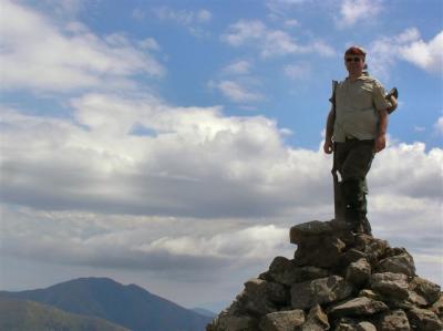 Robert on the Mt Loch Cairn with Mt Feathertop in background