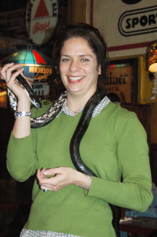 Girl with black rat snake celebrating St. Patrick's day 6830