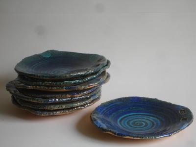 six blue spiral plates