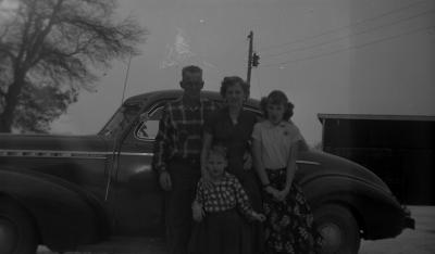 My Father, Mother Sister Judy and myself with our 1940 Chevy Coupe