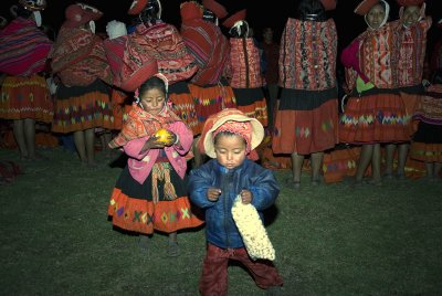 2 peruvian children leave the crowd
