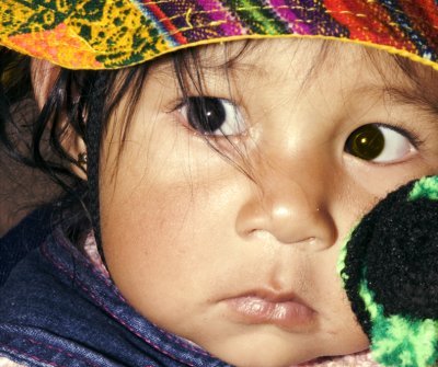 young child with toy night time_Peru