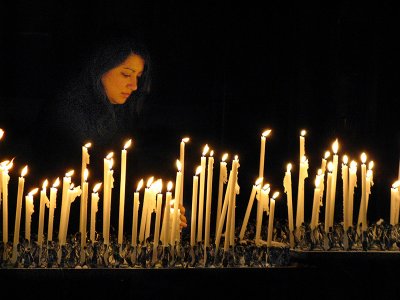 Inside the Duomo, lighting a candle .. A1746