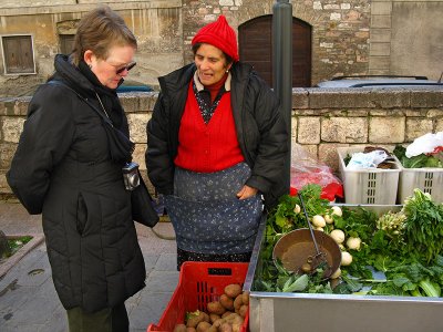 Margaret chatting with a vegetable seller .. A3955