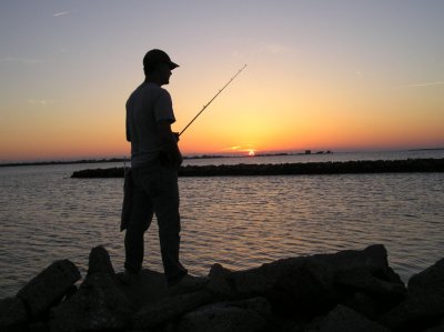 04-16-04 daniel fishing in sunset.jpg