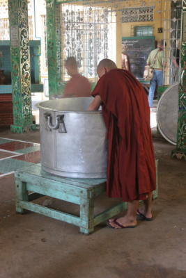 Monk at Rice Bin at Kyakhat Wine Monastery
