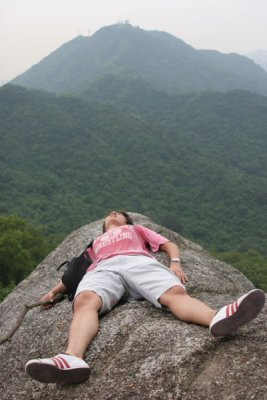 Eric resting on a rock on Lion Rock