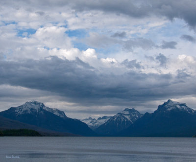 z P1080561 Blue sky as storm clouds develop over Lake McDonald in Glacier.jpg