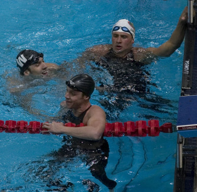 Michael Phleps, Ryan Lochte and Eric Vendt talking after the prelims