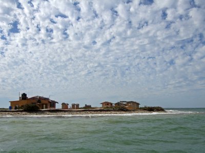 Camp from the water.  Many nice skies over the lagoon!