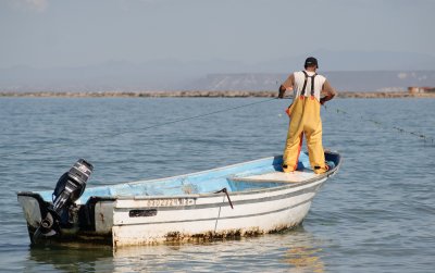 Pulling the boat along the anchor line