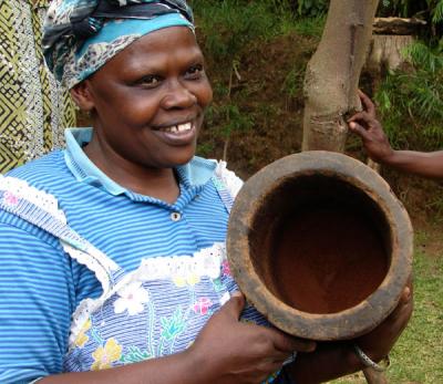 Mama Anna with ground (pounded) coffee