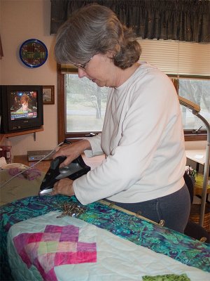 Bunny attaches the binding to Jan and Alberta's QOV