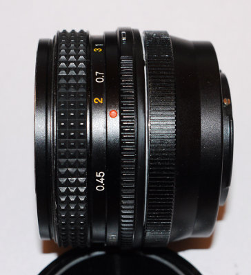 Konica 40mm f1.8 pancake 35mm SLR lens on 43rds to micro 43rds adapter.jpg