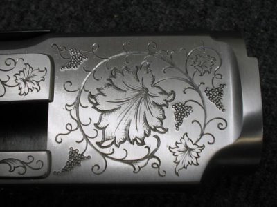 vine and leaf engraving on Antique rifle