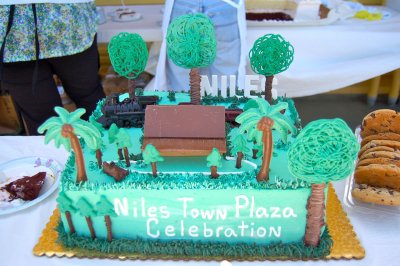The crown of the celebratory cake for Niles Town Plaza