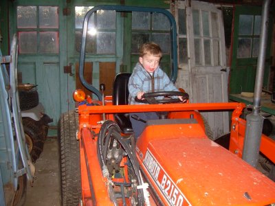 charlie  driving the tractor at mikeys farm