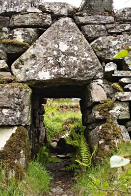 detail of the main entrance with massive and doubtless symbolic head stone