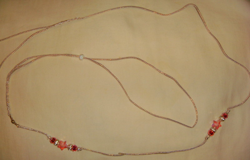 Gold cord with pink star beads
