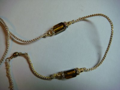 Lead 10-Gold and white cord with golden brown bead and gold accents