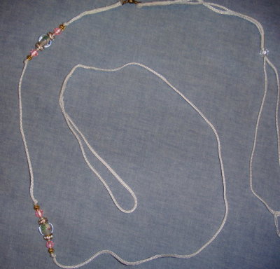 Lead 16-White cord with flower bead and pink accents
