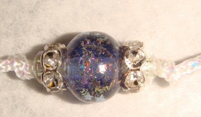 White Ird. cord wiht lavendar lampwork beads decorated with stars