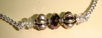Silver and bronze accent bead detail