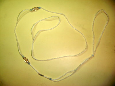 Lead 18- White Ird. cord with lavender accent beads